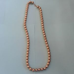 Gold bead for that holiday outfit or just that extra touch to jeans and sweater.